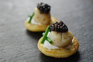 Blinis with cream cheese mousse, fried mini scallops and caviar