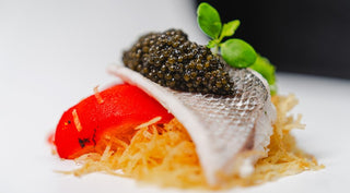 Seabass on Crispy Pai Potatoes With Grilled Peppers and Caviar